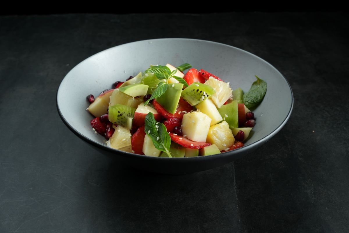 chopped fruits mixed in a bowl  