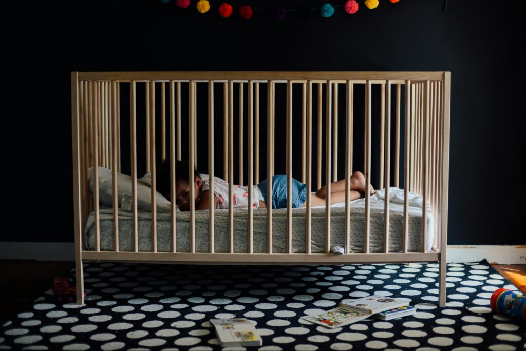 a baby sleeping in a crib